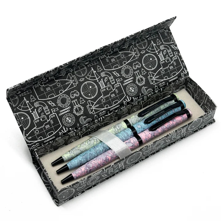 Set of three pens with marbleized designs in a decorative box with geometric patterns.