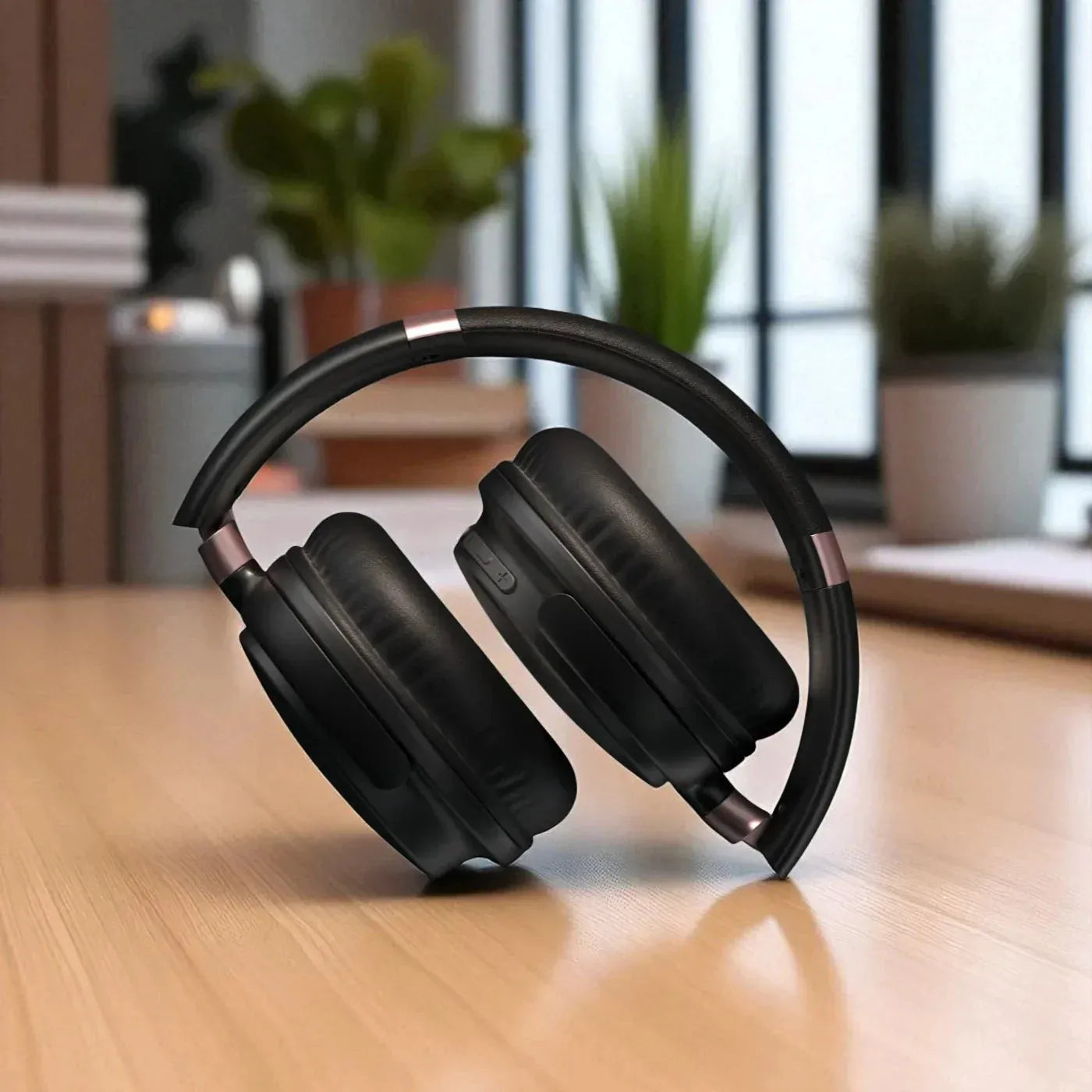 Black headphones on a wooden surface