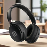 Black headphones on a wooden surface