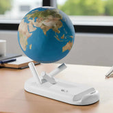 Magnetic levitating globe on a stand in an office setting