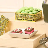 Green sugar-coated almonds and decorative chocolate bites from the Handpicked Flavour Box | Gift Hampers Online, perfect for gourmet gifting.