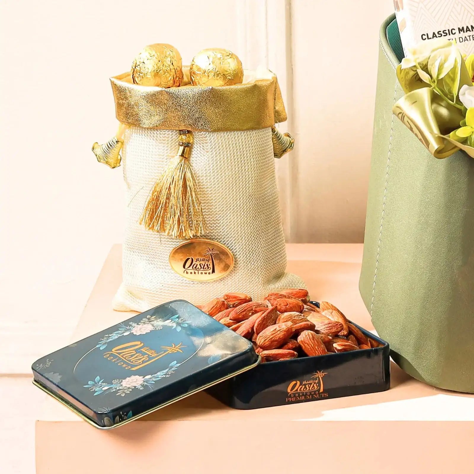 Premium dry fruits and gold-wrapped chocolates in elegant tins and pouches from the Indulgence Treasure Gourmet Hamper | Gift Hampers Online.