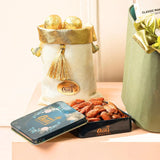 Premium dry fruits and gold-wrapped chocolates in elegant tins and pouches from the Indulgence Treasure Gourmet Hamper | Gift Hampers Online.