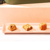 Assorted Middle Eastern sweets including baklava from the Indulgence Treasure Gourmet Hamper | Gift Hampers Online.