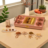 The Signature Gourmet Chest | Gift Hampers Online featuring assorted baklawa, premium dry fruits like almonds, pistachios, cashews, and raisins in a luxury tray.