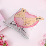 Custom Pinky Promise Cushion with names Karan and Kavya, ideal personalized gift for couples, displayed on a soft pink surface with floral decor.