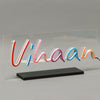 Multicolor LED Neon Sign spelling 'Vihaan' on transparent acrylic with sturdy black base, customizable for home décor or personalized gifts.