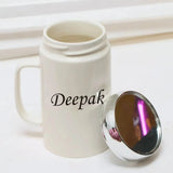 Open personalized ceramic coffee mug with mirror lid placed beside it, showcasing the name 'Deepak' on the front.