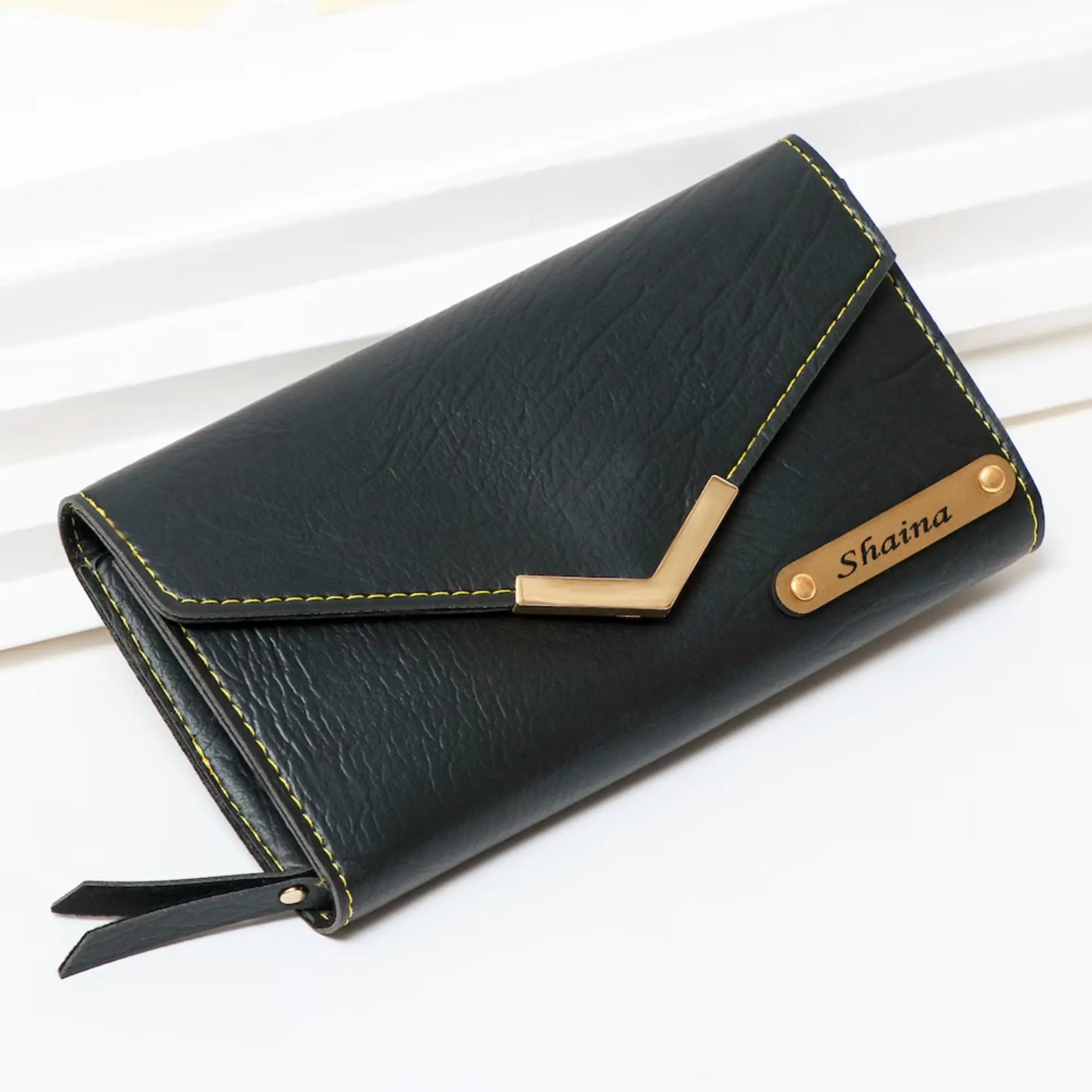 Black wallet with gold accents and 'Sobia' branding on a white background