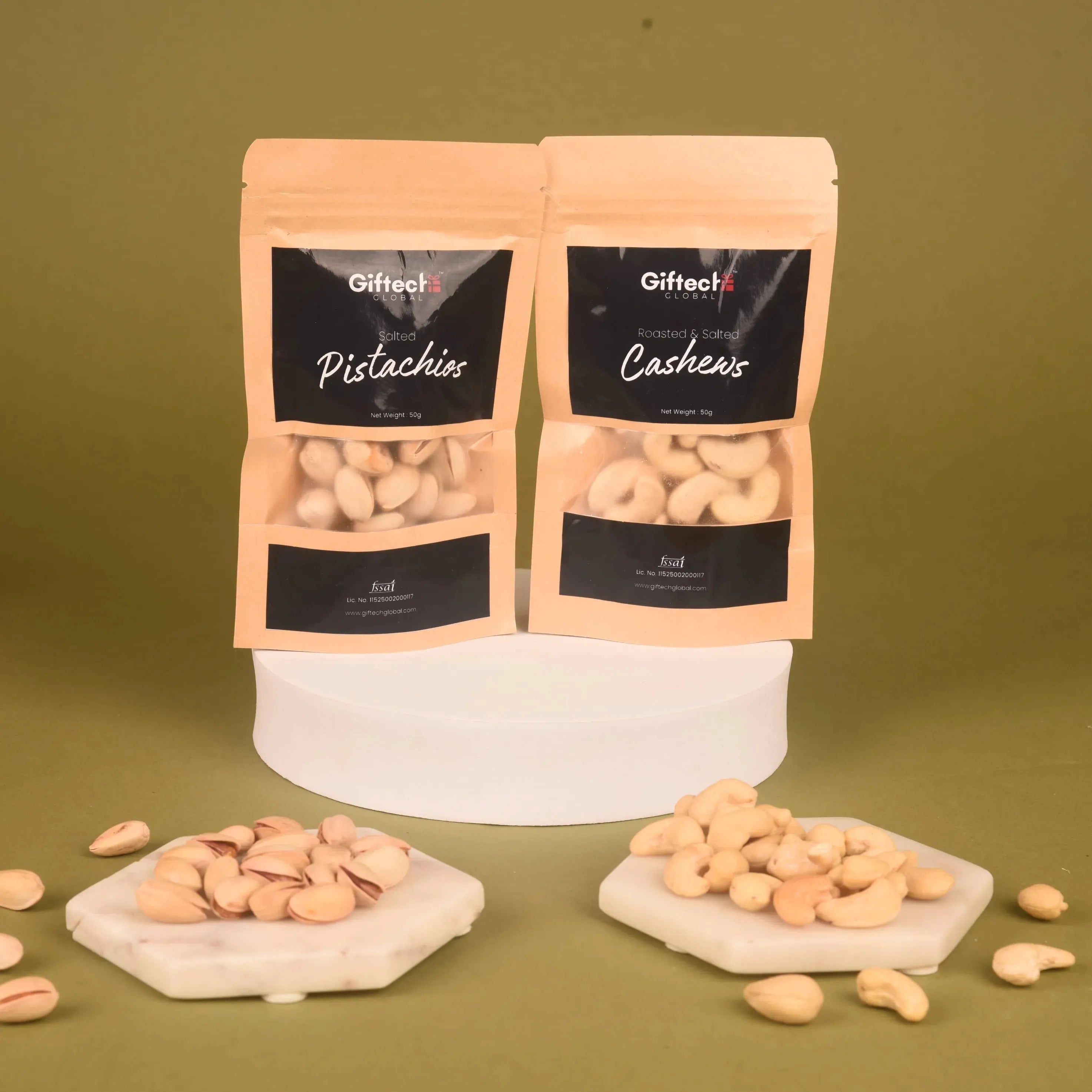 Royal Dryfruit Delight Diwali Gift Hamper showcasing roasted pistachios and cashews in resealable pouches with nuts arranged on marble coasters.