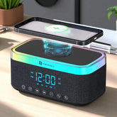 Portronics device with wireless charging pad and digital clock on a desk