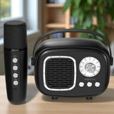 Black microphone and radio receiver on a wooden surface with a blurred indoor background