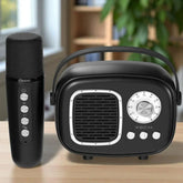 Black microphone and radio receiver on a wooden surface with a blurred indoor background