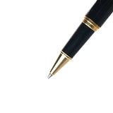 Black pen with gold accents on a white background