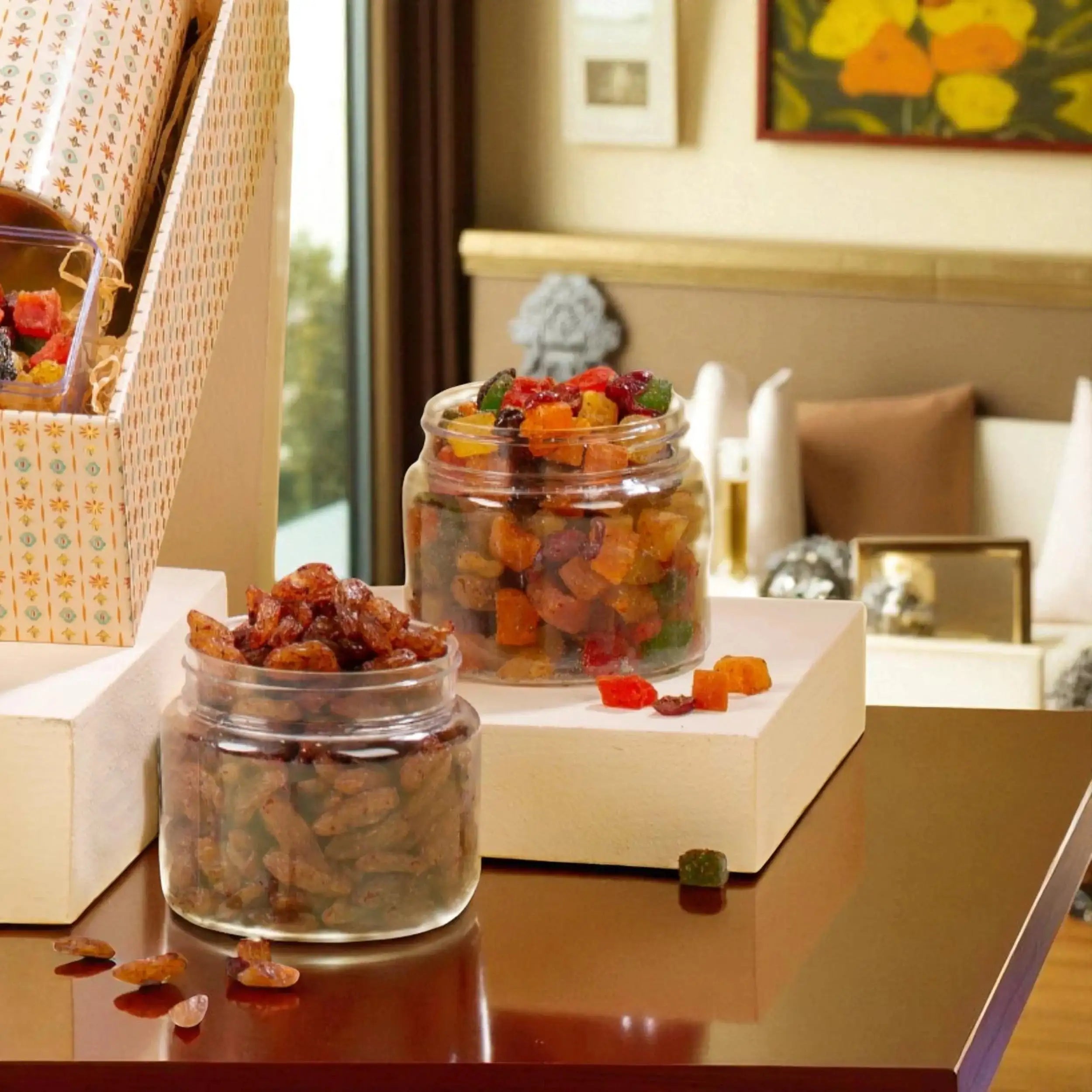 Jars of dried fruits and candied treats from the Grand Delights Gourmet Hamper, highlighting its premium snack selection for gourmet gift baskets.