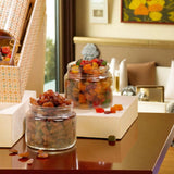 Jars of dried fruits and candied treats from the Grand Delights Gourmet Hamper, highlighting its premium snack selection for gourmet gift baskets.