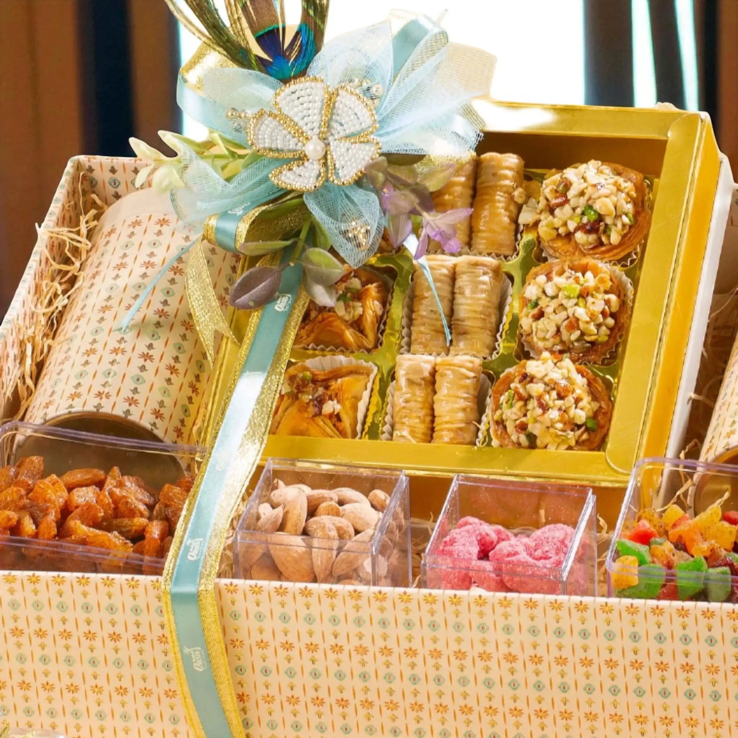 Top view of Grand Delights Gourmet Hamper showcasing baklava, nut clusters, and colorful candies in a luxury gift basket for festive gifting.