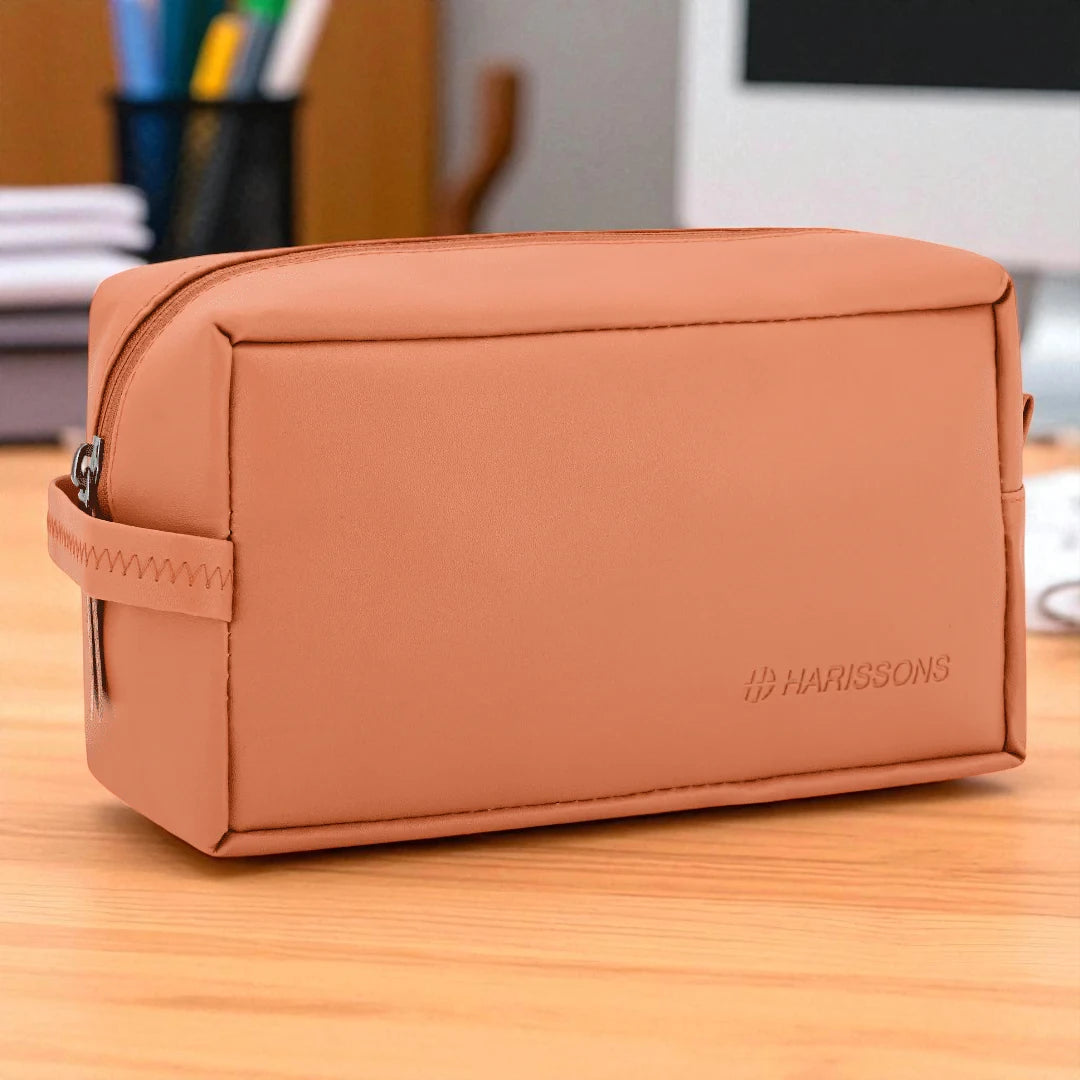 Brown pouch with Harissons branding on a wooden surface