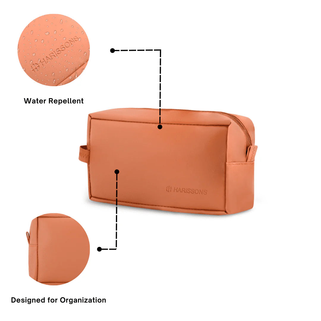 Orange toiletry bag with water repellent feature and organizational design on a white background