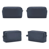 Four navy blue toiletry bags on a white background