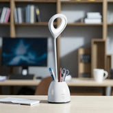 Desk lamp with pen holder on a desk in an office setting
