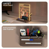 Light up acrylic board with calendar and desk organizer with stationery items on a desk.
