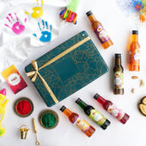 Festive Thandai Treats Box with Indian coolers and colorful powders for Holi celebrations