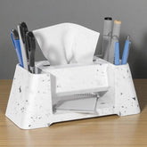 White marble-textured desk organizer with office supplies on a wooden surface.