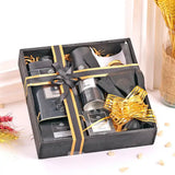 Top view of Yardley Black Kit for Men gift hamper including body spray, soap, talc, shaving cream, and chocolates in a festive box.