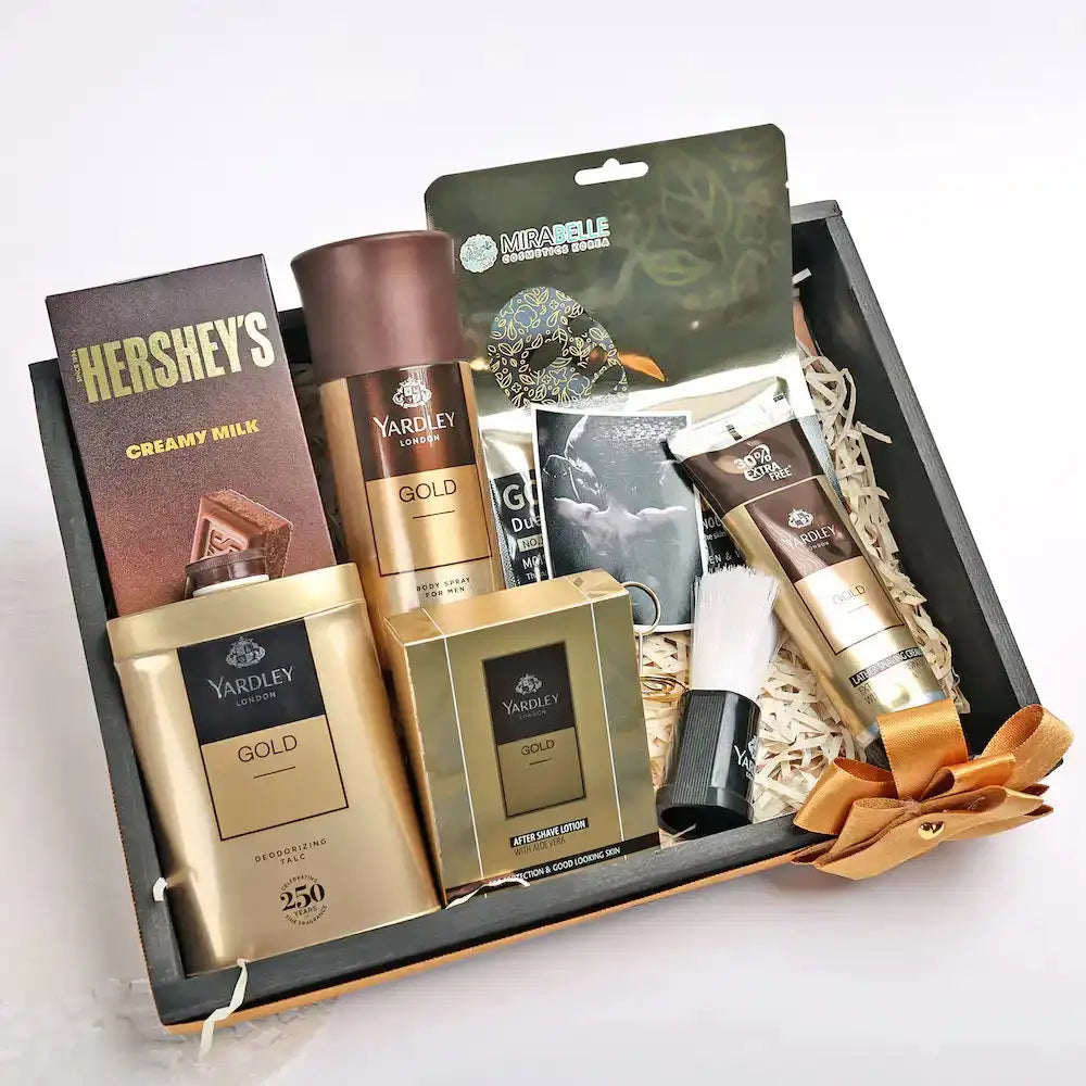 Yardley Gold Groom Kit Personalized Gift Set with shaving cream, lotion, talc, brush, and Hershey's chocolate in a decorative hamper box.