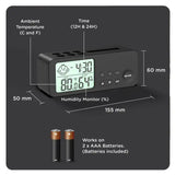 Digital clock with temperature, time, and humidity display on a black background