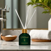 Patchouli scented diffuser on a bathroom counter with a blurred background