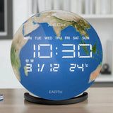 Globe-shaped digital clock displaying time and weather on a wooden surface.