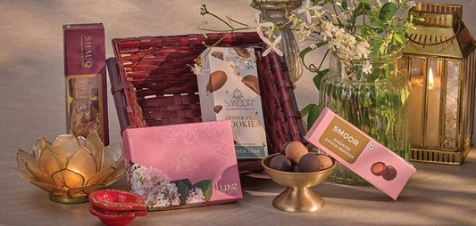 Luxury chocolate and cookie gift hamper for women with elegant decor.