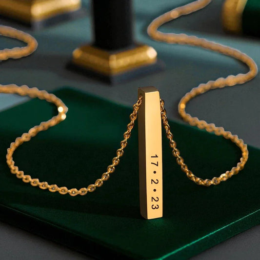 Gold bar necklace with engraved date, a thoughtful personalized gift.