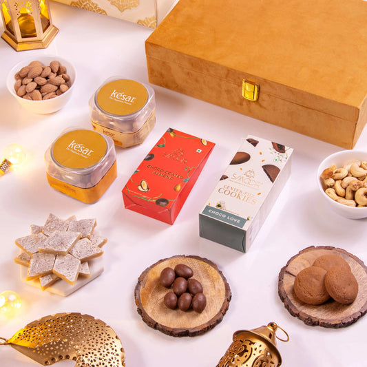 Festive gift box with sweets, cookies, nuts, and chocolates for Diwali.