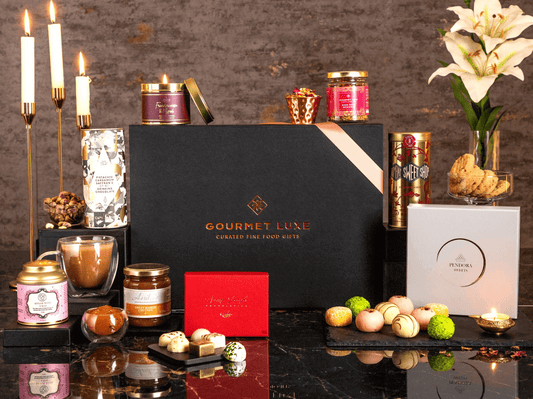Luxury birthday gift hamper with candles, chocolates, and gourmet treats.