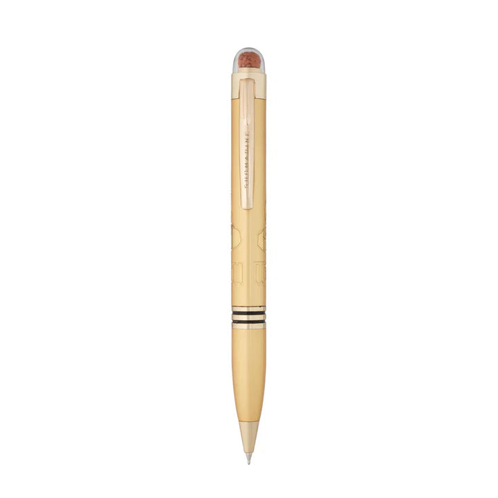 Gold pen with a textured grip on a white background