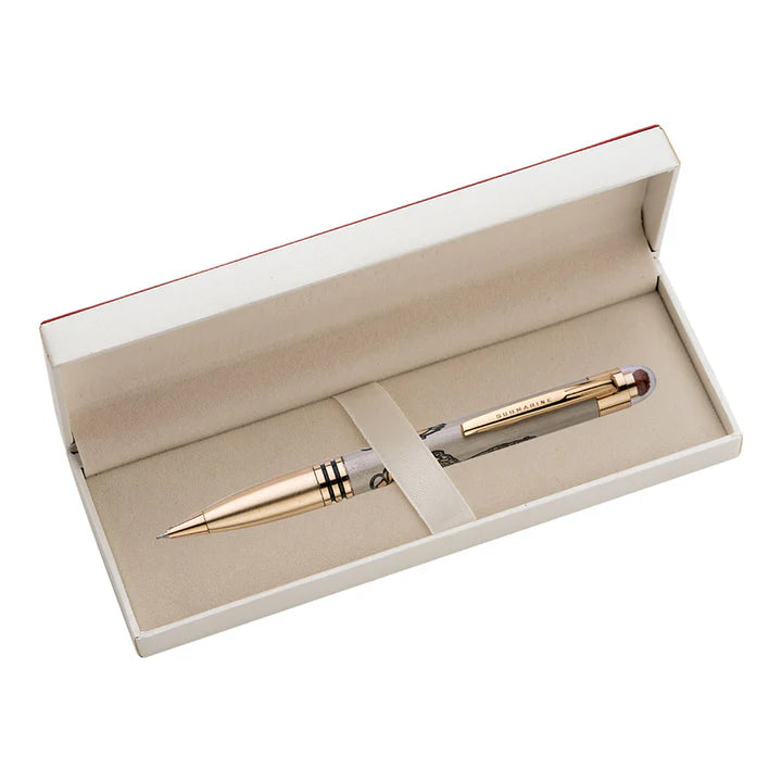 Gold pen in an open beige box on a white background