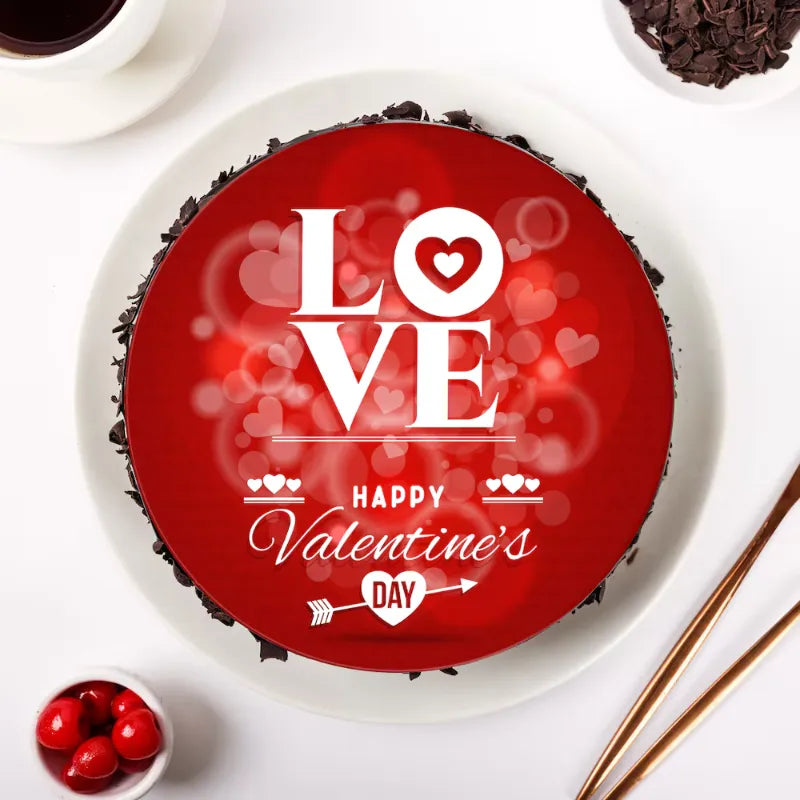 Heart-themed Chocolate Truffle Valentine Cake featuring red fondant top with love message, ideal for gifting on Valentine's Day with express delivery.