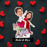 Unique Love Story Gift with Bollywood-style caricature of a couple, red hearts background, and custom names on a durable acrylic stand.