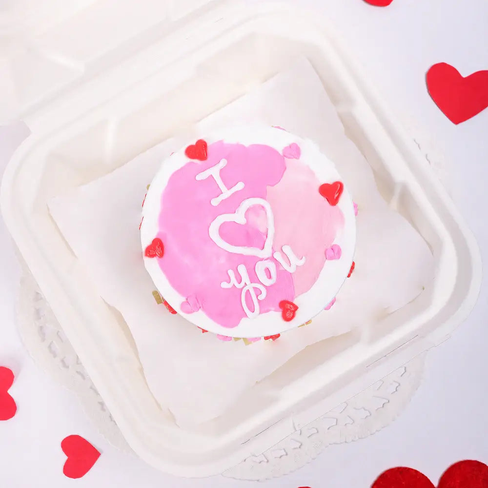 Lovely Pineapple Cake -valentine photo cake with heart-shaped pink and white frosting, decorated with red hearts and 'I ❤️ You' text, ideal for gifting.