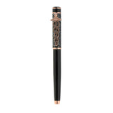 Decorative pen with black and rose gold design on a white background