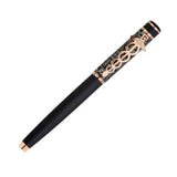 Decorative pen with black and rose gold design on a white background