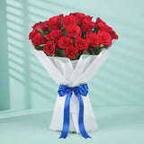 15 Red Roses Bouquet - red roses bouquet wrapped in white paper with blue ribbon, ideal for Valentine’s Day or romantic gift delivery.