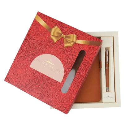 Gift set with red box, brown leather item, and pen on a white background