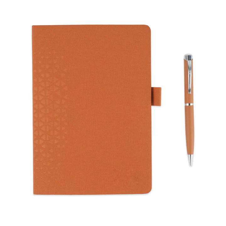Orange notebook with matching pen on a white background