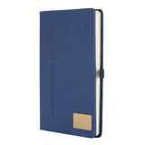 Blue notebook with a pen and gold emblem on a white background