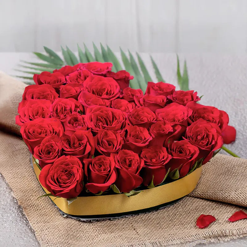 Heart-shaped box of Perky Blooms red roses with golden trim, ideal for Valentine's Day gifts and romantic flower delivery.