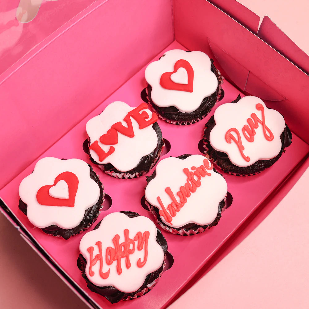 Happy Valentines Day Cupcakes - heart shaped red velvet 6 cupcake box with white fondant and red icing text in pink packaging.